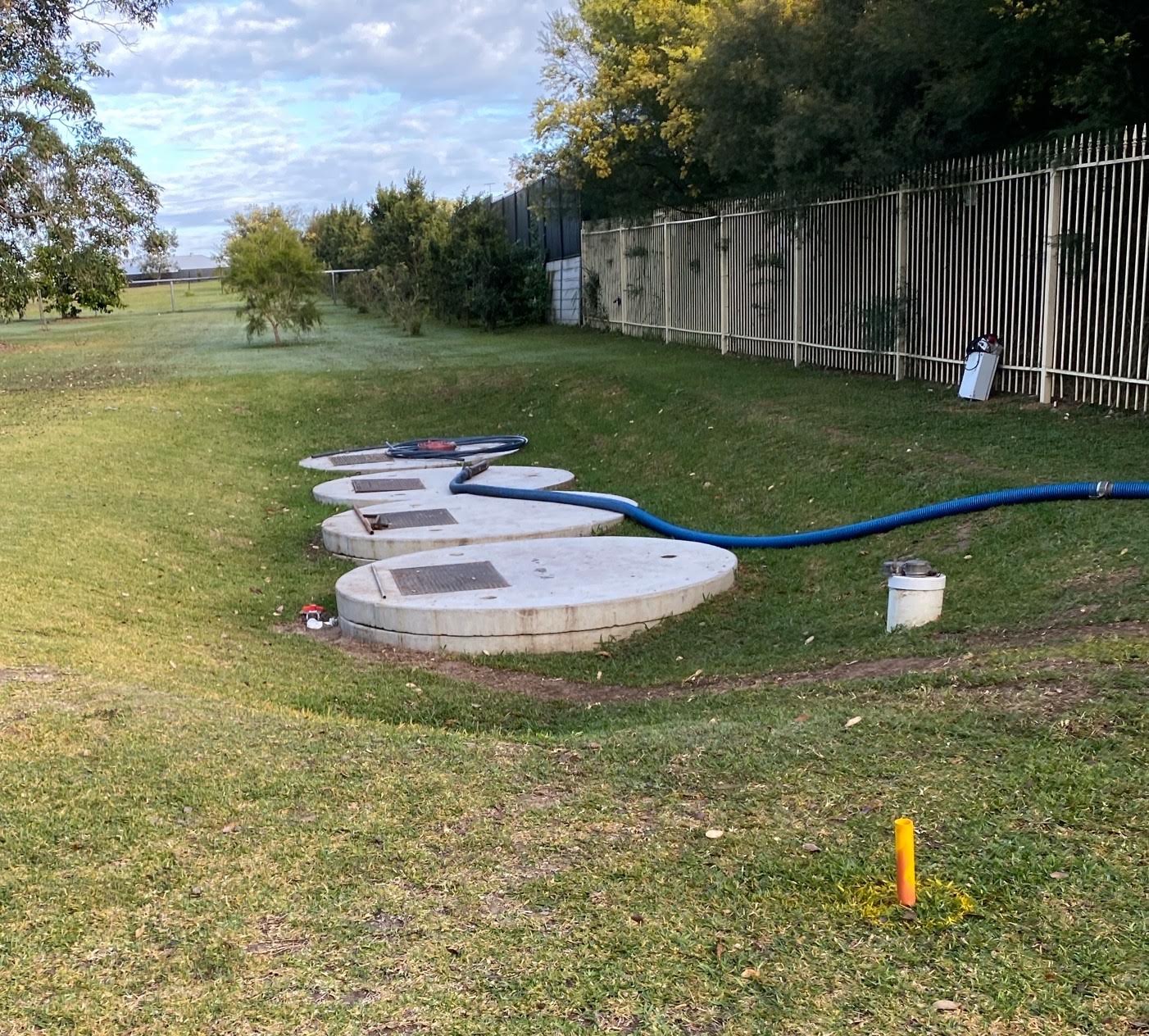 Holding-tank access lids with a collection hose connected