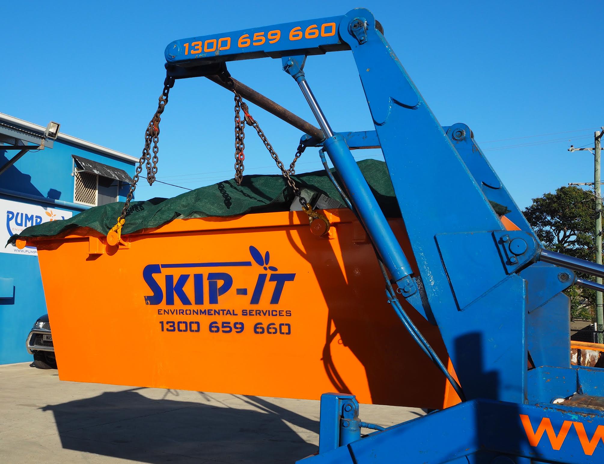 Skip-It truck unloading a covered four cubic metre skip bin