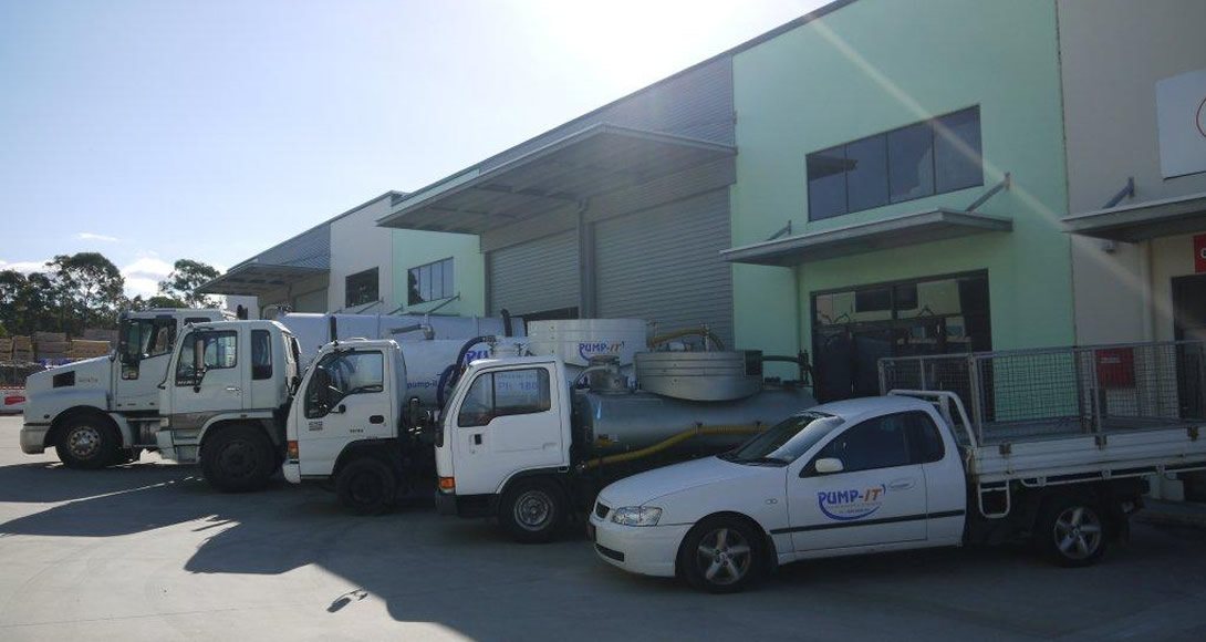 Pump-It vacuum tankers and service vehicles lined up at the yard