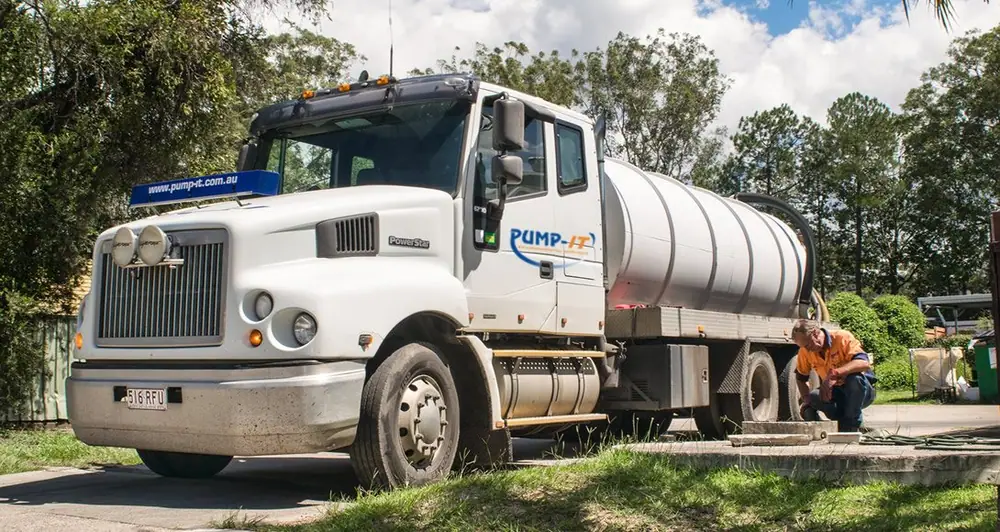 Pump-It vacuum tanker and operator at a residential property